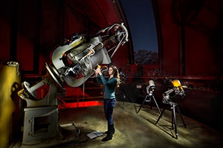Graduate Student Renata Cumbee working with the 24" telescope in the UGA Observatory