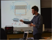 teacher standing in front of eraser board