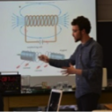 teacher standing in front of eraser board